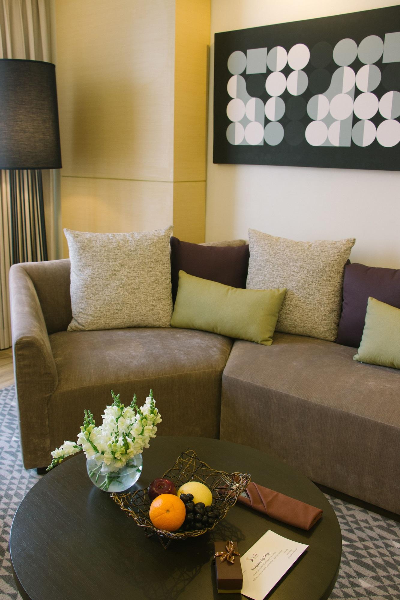 فندق سيدا، فيرتيس نورث كويزون سيتي المظهر الخارجي الصورة A sofa with cushions