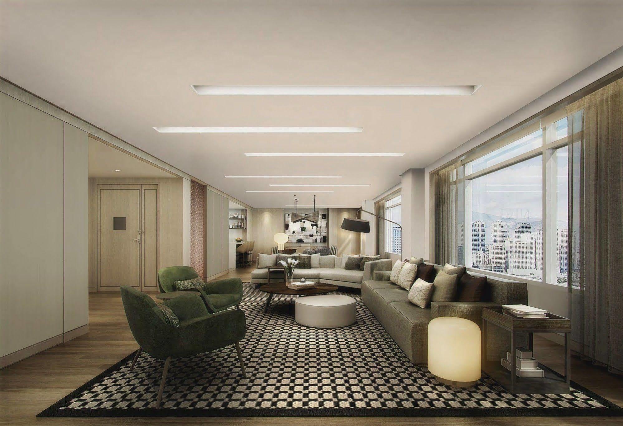 فندق سيدا، فيرتيس نورث كويزون سيتي المظهر الخارجي الصورة The living room of a three-bedroom apartment
